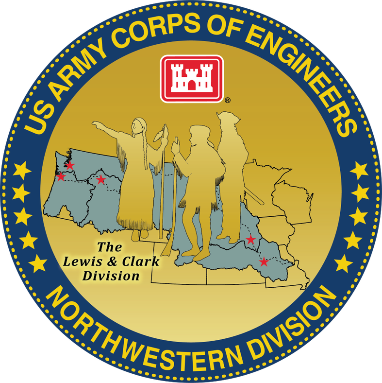 The division coin, updated in 2022 shows the Shoshone guide Sacajawea or Sacagawea (on the left of the coin face) who helped the Lewis and Clark with Expedition (Lewis and Clark are also represented William Clark in the middle wearing a coonskin cap and carrying a guide stick and Meriwether Lewis on the right carrying a gun and wearing military dress) in exploring the Louisiana Territory. Sacagawea traveled with the expedition thousands of miles from North Dakota to the Pacific Ocean which is shown in the background of the coin in green by outlining the area of responsibility of the Northwestern Division with points of the Omaha, Kansas City, Portland, Seattle and Walla Walla Districts marked in red. The words The Lewis and Clark Division are to the lower left and the circle is outlined in Navy Blue with the words US Army Corps of Engineers in gold and the words Northwestern Division below . 